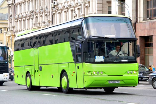 MOSCOW, RUSSIA - JUNE 2, 2013: Green Neoplan N1116 Cityliner interurban coach at the city street.