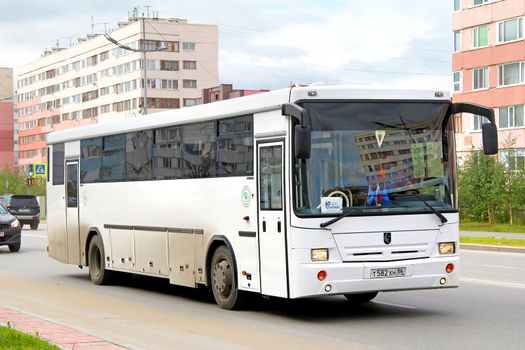 NOVYY URENGOY, RUSSIA - AUGUST 15, 2012: White NEFAZ 5299 interurban coach at the city street.