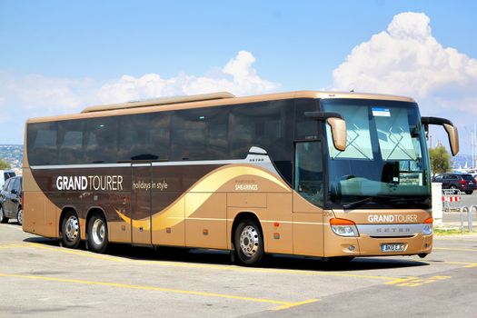 SAINT-TROPEZ, FRANCE - AUGUST 3, 2014: Brown Setra S416GT-HD interurban coach at the city parking.