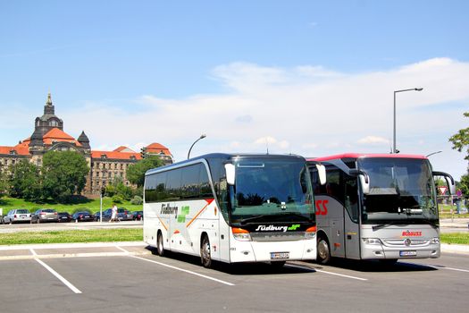 DRESDEN, GERMANY - JULY 20, 2014: Touristic coaches Setra S415HD and Mercedes-Benz Turk O350-15RHD Tourismo at the city street.