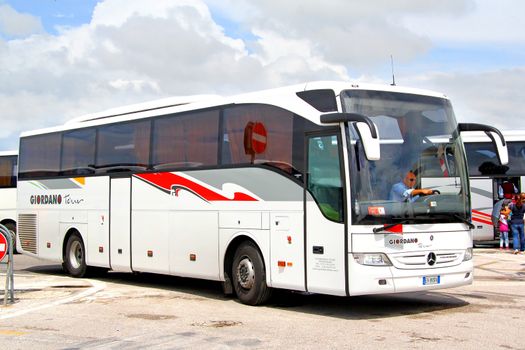 VENICE, ITALY - JULY 30, 2014: White interurban coach Mercedes-Benz O350-15RHD Tourismo at the touristic bus station.