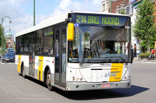 BRUSSELS, BELGIUM - AUGUST 9, 2014: White city bus VDL Jonckheere Transit at the city street.