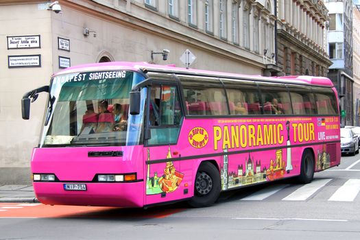 BUDAPEST, HUNGARY - JULY 23, 2014: Pink city sightseeing bus Neoplan N216 Jetliner at the city street.