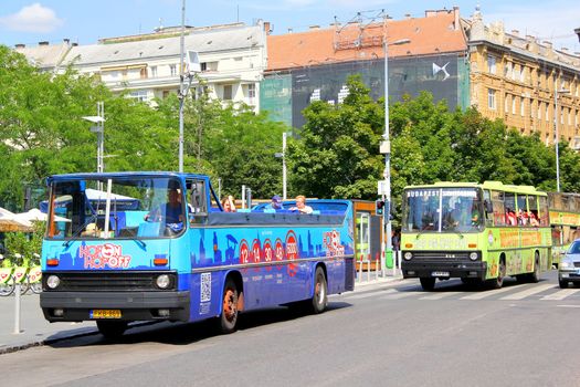 BUDAPEST, HUNGARY - JULY 25, 2014: City sightseeing buses Ikarus 256 at the city street.