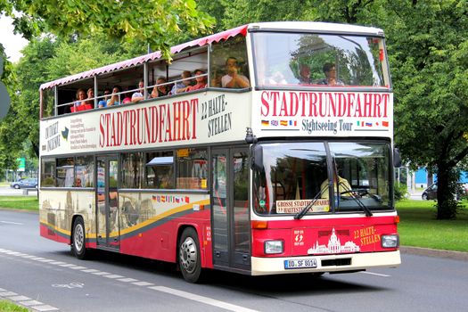 DRESDEN, GERMANY - JULY 21, 2014: Classic city sightseeing bus MAN SD202 at the city street.