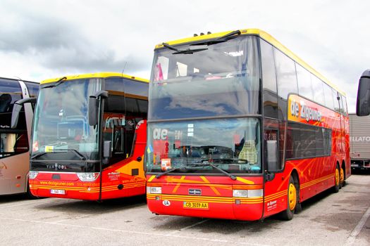 VENICE, ITALY - JULY 30, 2014: Interurban coaches Van Hool TX16 Astron and Van Hool TD927 Astromega at the touristic bus station.