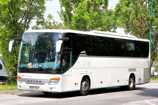 VENICE, ITALY - JULY 30, 2014: White interurban coach Setra S415GT-HD at the city street near the touristic bus station.