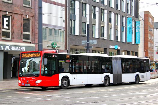 BREMEN, GERMANY - AUGUST 10, 2014: Modern articulated city bus Mercedes-Benz O530 Citaro G at the city street.