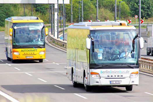 BERLIN, GERMANY -  AUGUST 17, 2014: Modern coach buses Setra 400-series at the interurban freeway.