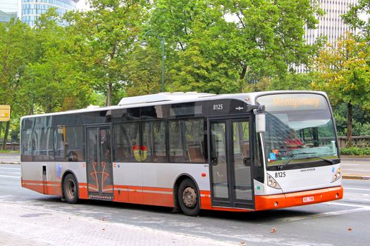 BRUSSELS, BELGIUM - AUGUST 9, 2014: City bus Van Hool A330 at the city street.