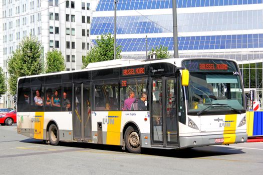 BRUSSELS, BELGIUM - AUGUST 9, 2014: City bus Van Hool A360 at the city street.
