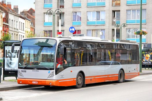 BRUSSELS, BELGIUM - AUGUST 9, 2014: City bus Van Hool A330 at the city street.