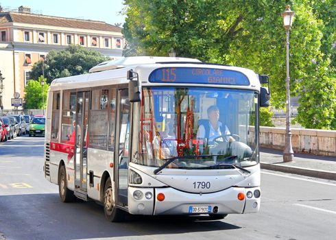 ROME, ITALY - AUGUST 1, 2014: Small city bus Autodromo Ale at the city street.