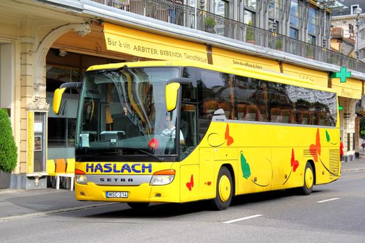 MONTREUX, SWITZERLAND - AUGUST 6, 2014: Modern touristic coach Setra S415GT-HD at the city street.