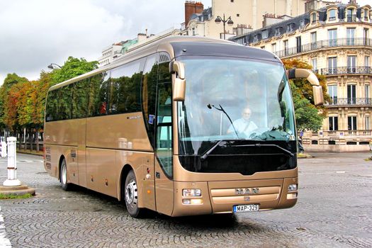 PARIS, FRANCE - AUGUST 8, 2014: Touristic coach MAN R08 Lion's Coach at the city street.