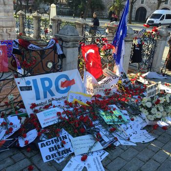 TURKEY, Istanbul: People left flowers, signs and flags for the victims of a suicide bombing in Sultanahmet Square in Istanbul, Turkey on January 14, 2016.The Sultanahmet district bombing on Tuesday morning killed at least 10 people in a popular tourist area in the city.