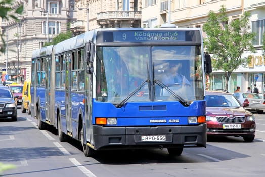 BUDAPEST, HUNGARY - JULY 25, 2014: Blue articulated city bus Ikarus 435.06 at the city street.