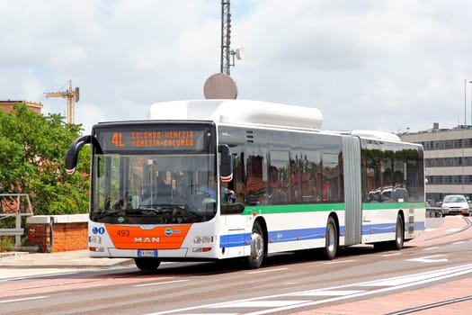 VENICE, ITALY - JULY 30, 2014: Articulated city bus MAN A23 Lion's City G at the city street.