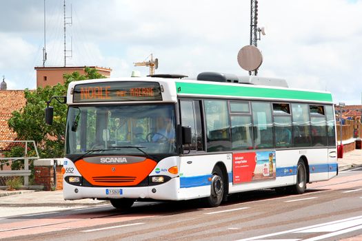 VENICE, ITALY - JULY 30, 2014: White city bus Scania OmniCity CN94UB at the city street.