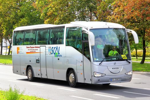 SZCZECIN, POLAND - AUGUST 13, 2014: Grey interurban coach Irizar Century at the city street.