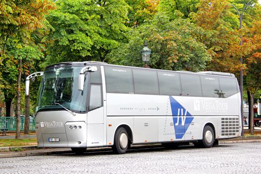 PARIS, FRANCE - AUGUST 8, 2014: Silver touristic coach VDL Bova Futura at the city street.