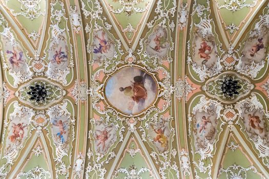 TRENTO, ITALY - CIRCA DECEMBER 2015: Painting decorated ceiling of an ancient Christian church.