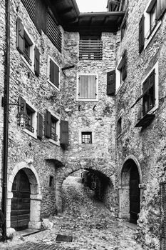 Narrow alley in a medieval village in northern Italy.
