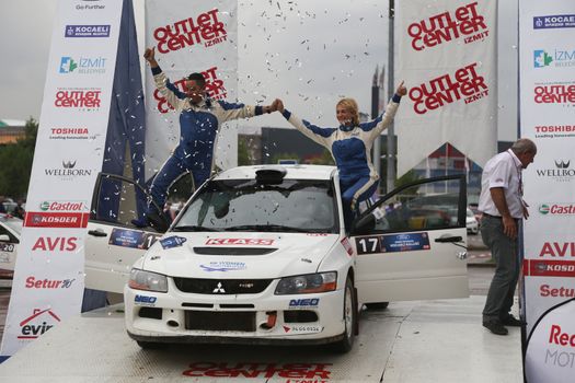 KOCAELI, TURKEY - AUGUST 23, 2015: Simin Bicakcioglu with Mitsubishi Evo IX of Neo Motorspor Team in Podium Ceremony of Kocaeli Rally 2015