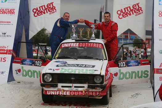 KOCAELI, TURKEY - AUGUST 23, 2015: Hannu Pulkkinen with Ford Escort MK2 of Bonus Unifree Parkur Racing Team in Podium Ceremony of Kocaeli Rally 2015