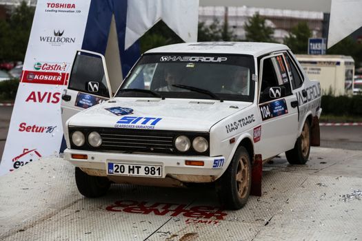 KOCAELI, TURKEY - AUGUST 23, 2015: Emre Hasbay with Fiat 131 of Deltasport Team in Podium Ceremony of Kocaeli Rally 2015