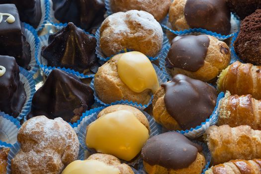 In the pictured colorful pastries with candied,cream and chocolate from above,the real Italian confectionery.