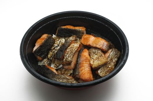 Grilled Salmon over boiled rice in bowl