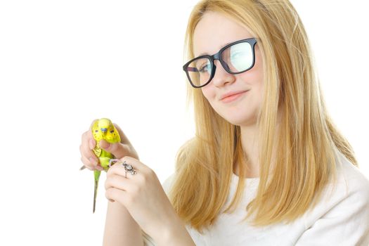 A girl with glasses and a parrot