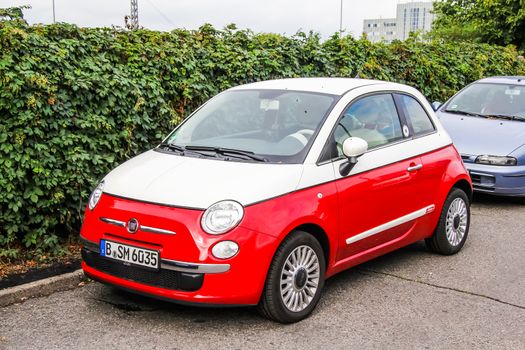 BERLIN, GERMANY - SEPTEMBER 11, 2013: Motor car Fiat 500 at the city street.