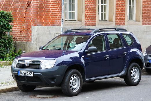 BERLIN, GERMANY - SEPTEMBER 12, 2013: Motor car Dacia Duster at the city street.