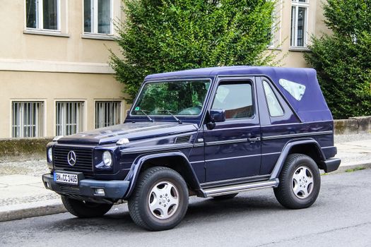 BERLIN, GERMANY - SEPTEMBER 12, 2013: Motor car Mercedes-Benz W463 G-class at the city street.