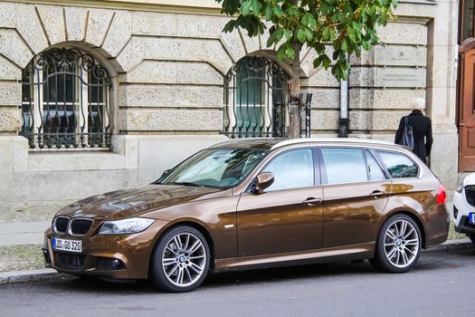 BERLIN, GERMANY - SEPTEMBER 12, 2013: Motor car BMW E91 3-series at the city street.