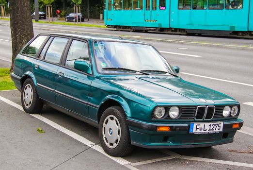 FRANKFURT AM MAIN, GERMANY - SEPTEMBER 15, 2013: Motor car BMW E30 3-series at the city street.