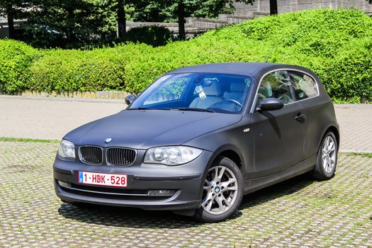 BRUSSELS, BELGIUM - AUGUST 9, 2014: Motor car BMW E81 1-series at the city street.