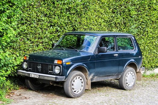 MONTREUX, SWITZERLAND - AUGUST 6, 2014: Motor car Lada Niva at the city street.