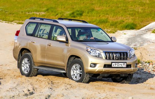 NOVYY URENGOY, RUSSIA - SEPTEMBER 2, 2012: Motor car Toyota Land Cruiser Prado 150 at the city street.