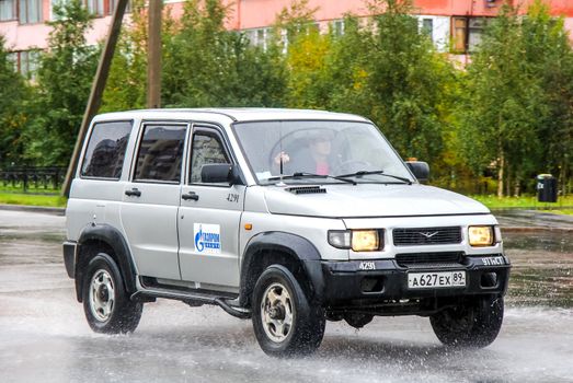 NOVYY URENGOY, RUSSIA - AUGUST 20, 2012: Motor car UAZ 3162 Simbir at the city street.