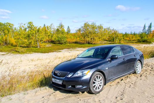 NOVYY URENGOY, RUSSIA - SEPTEMBER 2, 2012: Motor car Lexus GS at the countryside.
