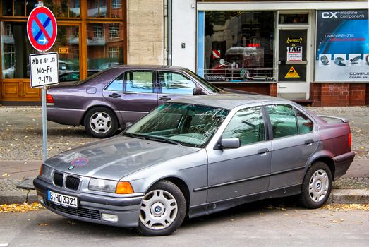 BERLIN, GERMANY - SEPTEMBER 10, 2013: Motor car BMW E36 3-series at the city street.