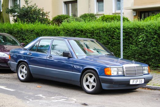 FRANKFURT AM MAIN, GERMANY - SEPTEMBER 15, 2013: Motor car Mercedes-Benz W201 190E at the city street.