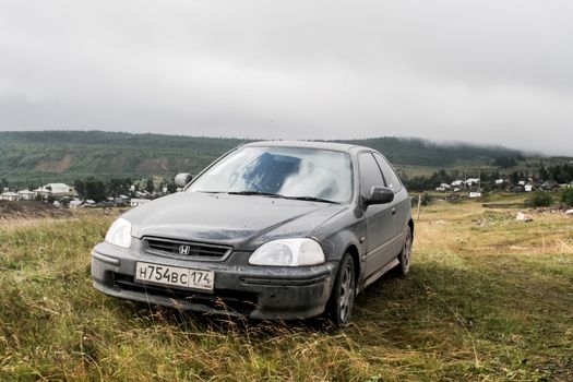 IRKUSKAN, RUSSIA - AUGUST 8, 2008: Motor car Honda Civic at the countryside.