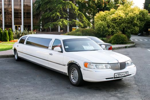 SOCHI, RUSSIA - JULY 19, 2009: White limousine Lincoln Town Car at the city street.