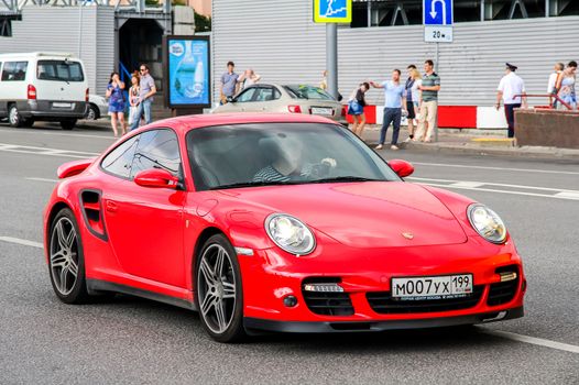 MOSCOW, RUSSIA - JULY 7, 2012: Motor car Porsche 997 911 at the city street.