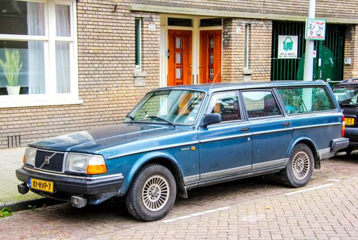 AMSTERDAM, NETHERLANDS - AUGUST 10, 2014: Motor car Volvo 200-series at the city street.