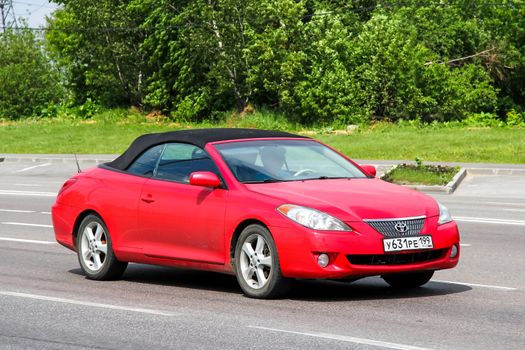 MOSCOW, RUSSIA - JUNE 2, 2012: Motor car Toyota Camry Solara at the interurban freeway.
